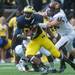 Michigan tight end Devin Funchess is tackled by Central Michigan's left end Blake Serpa during the first quarter of their game, Saturday, Aug, 31.
Courtney Sacco I AnnArbor.com  